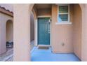 Up close front door featuring a glass peephole, security features, and a welcome mat at 10139 Palazzo Marcelli Ct, Las Vegas, NV 89147