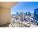 City views from a balcony with clear glass railings in a high-rise condo, sunny skies at 135 E Harmon Ave # 2821, Las Vegas, NV 89109