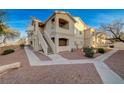 Attractive two-story condo building with private balconies and nicely landscaped common areas at 1881 W Alexander Rd # 1135, North Las Vegas, NV 89032