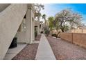 Side view of condo exterior with walkway at 1881 W Alexander Rd # 1135, North Las Vegas, NV 89032