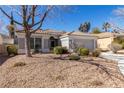 Charming single-story home with desert landscaping and a two-car garage at 1905 Sirocco Ct, Las Vegas, NV 89117