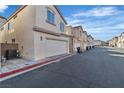 Exterior shot of a home showcasing the garage and street view at 3137 Sunrise Cove Ave, North Las Vegas, NV 89031