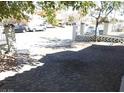 Paved driveway with decorative brickwork leading to a home with a decorative perimeter fence at 3539 Japan Way, Las Vegas, NV 89115