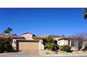 Charming single-story home features a desert landscape, a two car garage, and a well-maintained front yard at 5059 Pensier St, Las Vegas, NV 89135