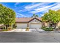 Charming single-story home with a well-manicured lawn and a two-car garage at 5078 Shadow River St, Las Vegas, NV 89148