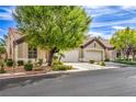 Lovely single-story home with mature trees, lush landscaping, and a two-car garage at 5078 Shadow River St, Las Vegas, NV 89148