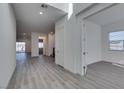 Bright foyer featuring tile floors, recessed lighting, and modern doors at 522 Riley Ridge Ct, Henderson, NV 89012