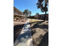 A beautiful landscape of the apartment complex with a sidewalk at 575 S Royal Crest Cir # 18, Las Vegas, NV 89169