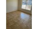 Neutral living room featuring neutral walls and tile flooring at 575 S Royal Crest Cir # 18, Las Vegas, NV 89169