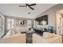 Living room showcasing modern furniture, a large mirror, and a sleek television at 7250 Diamond Canyon Ln # 204, Las Vegas, NV 89149