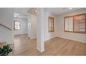 Spacious living room with wood-look floors and shuttered windows for natural light at 8027 Anasazi Ranch Ave, Las Vegas, NV 89131