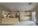 Kitchen showcasing stainless steel appliances, white cabinets and countertops, with an open layout at 8212 Cabin Springs Ave, Las Vegas, NV 89131