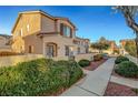 Charming two-story townhome has desert landscaping, walkway, a private front yard, and a stucco facade at 9564 Belle Fountain Ave, Las Vegas, NV 89123