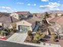 Charming single-story home featuring desert landscaping, a two-car garage, and a tile roof at 7400 Quail Heights Ave, Las Vegas, NV 89131