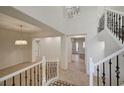 Bright foyer with high ceilings, decorative staircase, and tile flooring at 10530 Eagle Nest St, Las Vegas, NV 89141