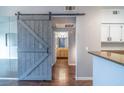 Modern interior showcasing a barn door, hardwood floors, and stylish accents at 10550 W Alexander Rd # 2057, Las Vegas, NV 89129