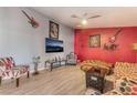 A spacious living room featuring unique decor, a ceiling fan, and two-tone paint at 2028 Rustler Ridge Ave, North Las Vegas, NV 89031