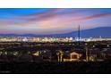 An illuminated cityscape view in the distance, with neighborhood and mountains in background at 2869 Josephine Dr, Henderson, NV 89044