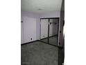 Neutral bedroom with carpet flooring and a mirrored sliding-door closet at 4536 E Baltimore Ave, Las Vegas, NV 89104