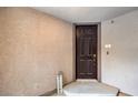 Exterior entry featuring a dark wood door with a 'Welcome' sign at 7232 N Decatur Blvd # 4, Las Vegas, NV 89131