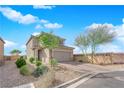 Beautiful two-story home with desert landscaping and a brick driveway at 8495 Green Alder Ct, Las Vegas, NV 89113