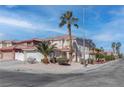 Inviting two-story home featuring lush landscaping, a tile roof, and a spacious two-car garage at 9680 Granite Gorge Ct, Las Vegas, NV 89148