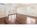 Spacious living room with hardwood floors and many windows at 9725 Sierra Mesa Ave, Las Vegas, NV 89117