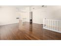 Open living room with hardwood floors leading to the staircase at 9725 Sierra Mesa Ave, Las Vegas, NV 89117