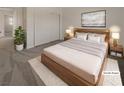 Staged bedroom with a modern bed frame, white walls, and carpet flooring at 9885 Ramhorn Canyon St, Las Vegas, NV 89183