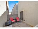 Outdoor patio featuring comfortable lounge chairs and a grill at 9920 Keephills St, Las Vegas, NV 89183