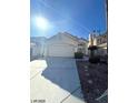 Attractive single-level house with a two-car garage, desert landscaping, and a welcoming facade at 1213 Daytona Ln, Las Vegas, NV 89117