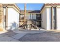 Bright living room featuring a balcony, gray walls, and hard surface flooring at 1405 Vegas Valley Dr # 306, Las Vegas, NV 89169
