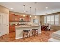 Eat-in kitchen featuring granite counters, stainless appliances, and a cozy breakfast bar with seating at 1908 Morro Vista Dr, Las Vegas, NV 89135