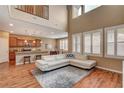 Bright living room with high ceilings, wood floors, and updated kitchen, ideal for entertaining at 1908 Morro Vista Dr, Las Vegas, NV 89135