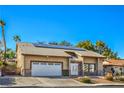 Single-story home featuring a well-maintained lawn and a two-car garage, enhancing curb appeal at 2233 Marlboro Dr, Henderson, NV 89014