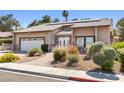 Well-maintained single-story home with desert landscaping, solar panels and brick accents on the facade at 2233 Marlboro Dr, Henderson, NV 89014