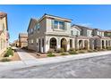Attractive home featuring a classic stucco exterior, blue shutters, and a well-kept front yard at 3732 Via Gennaro, Henderson, NV 89044