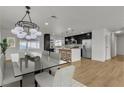 Open-concept kitchen with stainless steel appliances that opens to dining area at 4578 Ridgedale Ave, Las Vegas, NV 89121