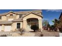 Inviting two-story home featuring a well-manicured desert landscape at 4798 Luna Ridge Ct, Las Vegas, NV 89129