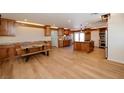 Spacious kitchen boasting wood cabinets, a large island, and modern lighting fixtures at 524 8Th St, Boulder City, NV 89005