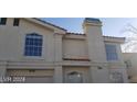 Two-story home featuring symmetrical windows and architectural details on a sunny day at 7963 Laurena Ave, Las Vegas, NV 89147
