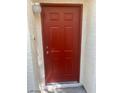 A close-up shot of the red front door at 7963 Laurena Ave, Las Vegas, NV 89147