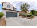Charming home with a two-car garage, neutral color palette, complemented by well maintained landscaping at 8124 Loma Del Ray St, Las Vegas, NV 89131