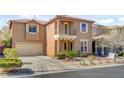 Charming two-story home with a driveway leading to the attached two car garage at 9413 Ironsend St, Las Vegas, NV 89143