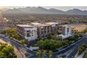 Beautiful aerial view of this modern complex surrounded by greenery and mountains in the background at 11441 Allerton Park Dr # 217, Las Vegas, NV 89135