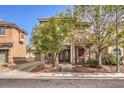 Two-story home with double door entry, large trees, and a two-car garage at 1332 Cedar Berry Ct, Henderson, NV 89012