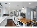 Bright kitchen with a large island, white cabinets, stainless steel appliances and adjacent dining space at 1404 Colony Pine St, Las Vegas, NV 89144