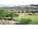 Beautiful view of the golf course, community homes, and desert mountains in the distance at 21 Via Visione # 201, Henderson, NV 89011