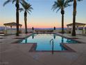 Community pool featuring beautiful mountain views, palm trees, cabanas and plenty of space to enjoy the outdoors at 21 Via Visione # 201, Henderson, NV 89011