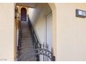 Exterior staircase with metal railing leads to upper-level unit entrance at 21 Via Visione # 201, Henderson, NV 89011